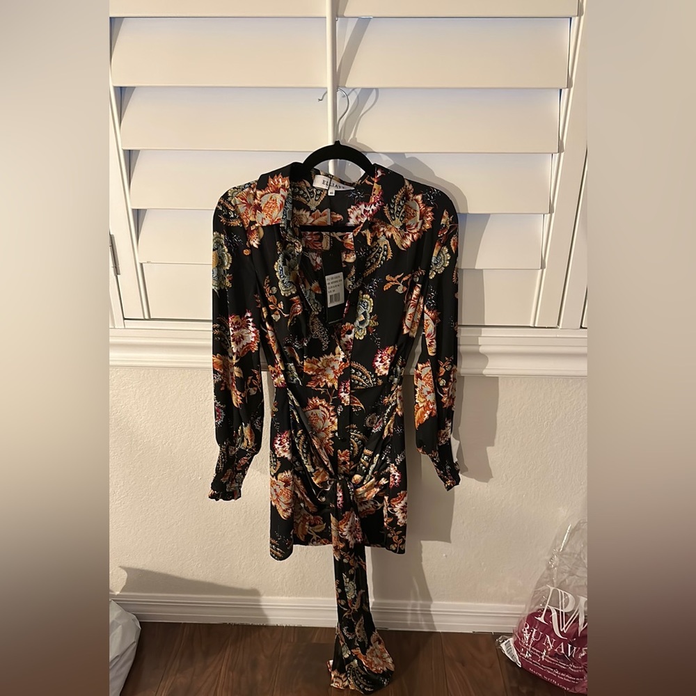 Brand new dress with Chinese style flower pattern. Never worn.